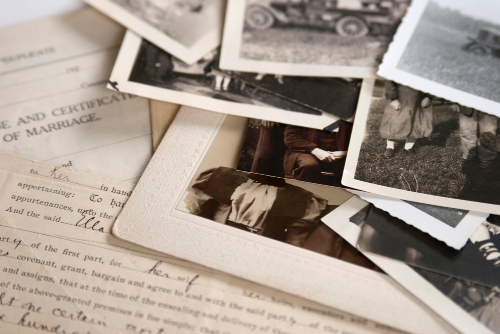 The Best Way To Trace Your Ancestors, Family generation photos with birth certificates in a pile